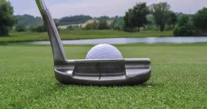 using nike putter to strike the ball