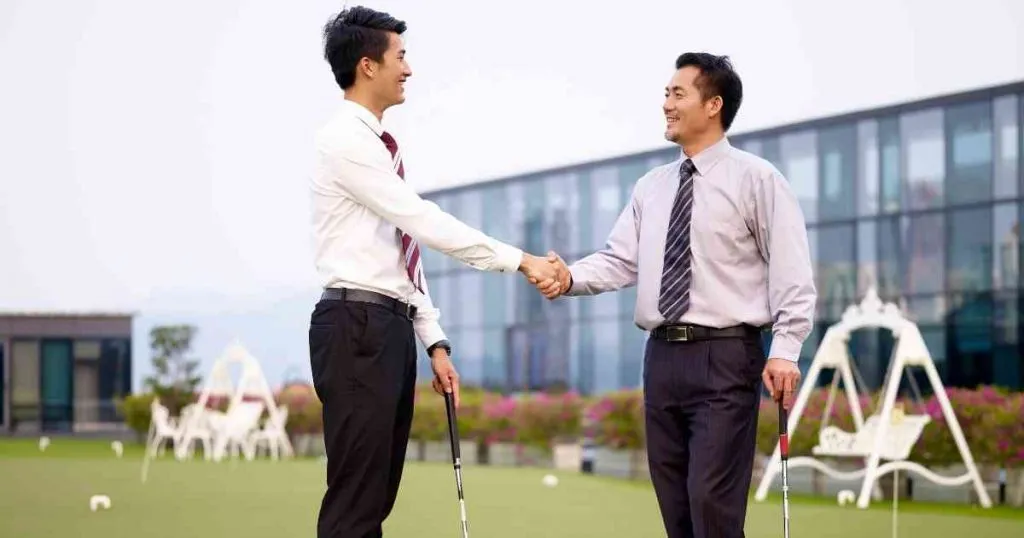 business men playing golf