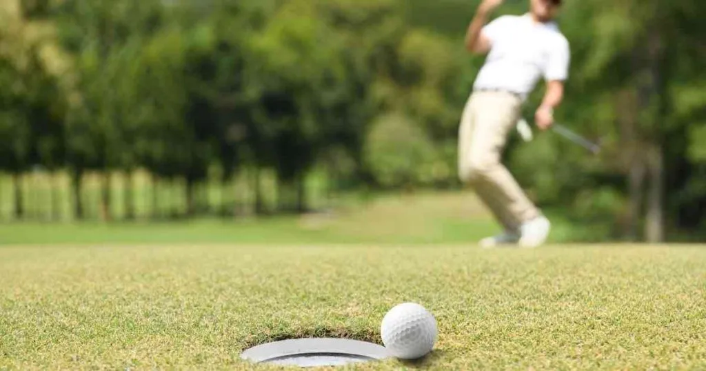 man shooting the gold ball