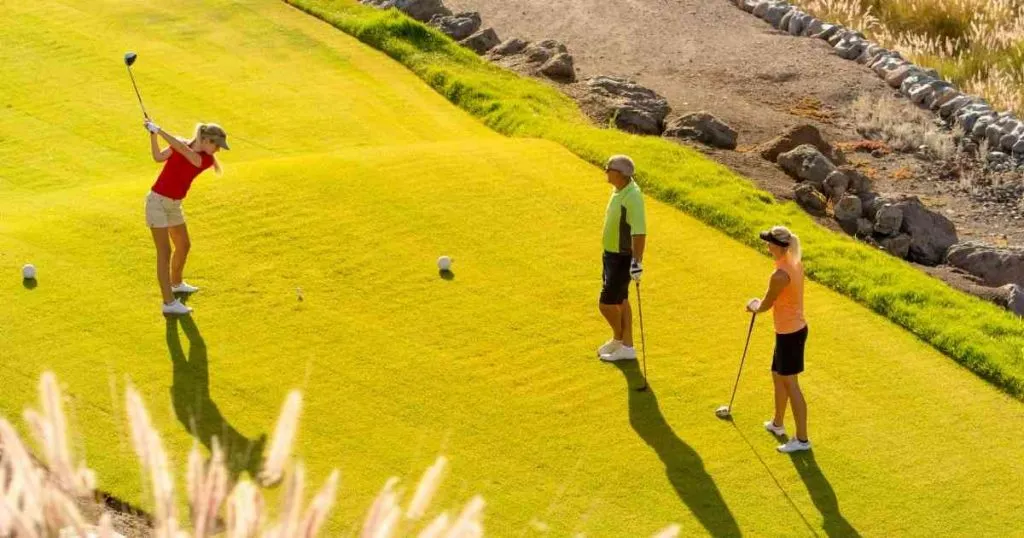 friends playing golf