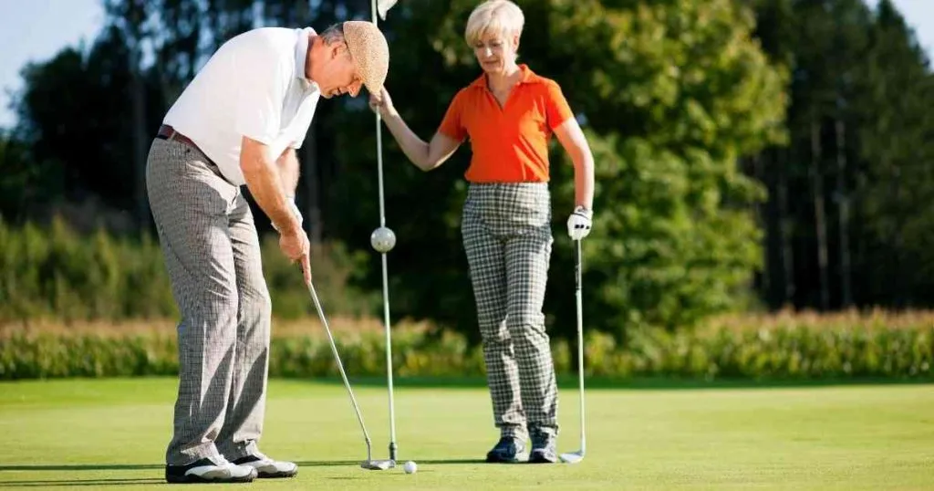 old people playing golf