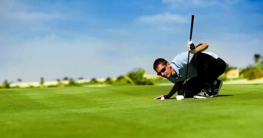 man checking how to shot the golf ball