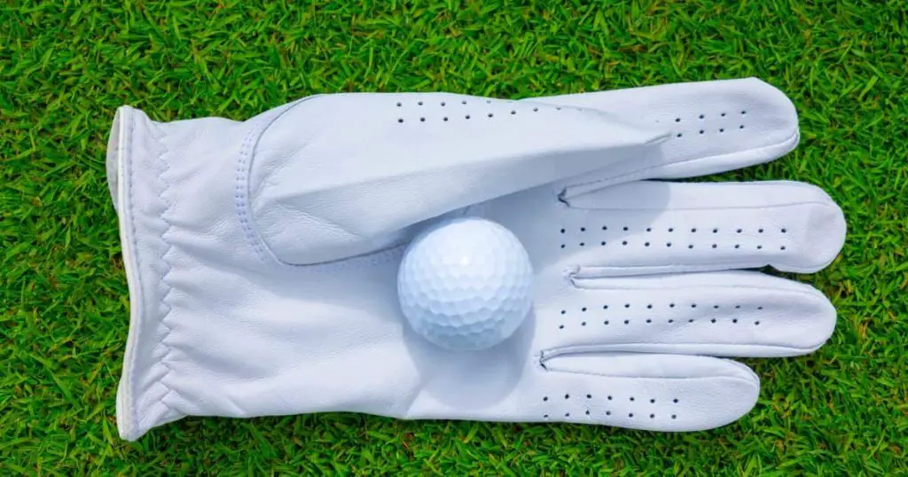 Golf Glove with Golf Ball on the Grass